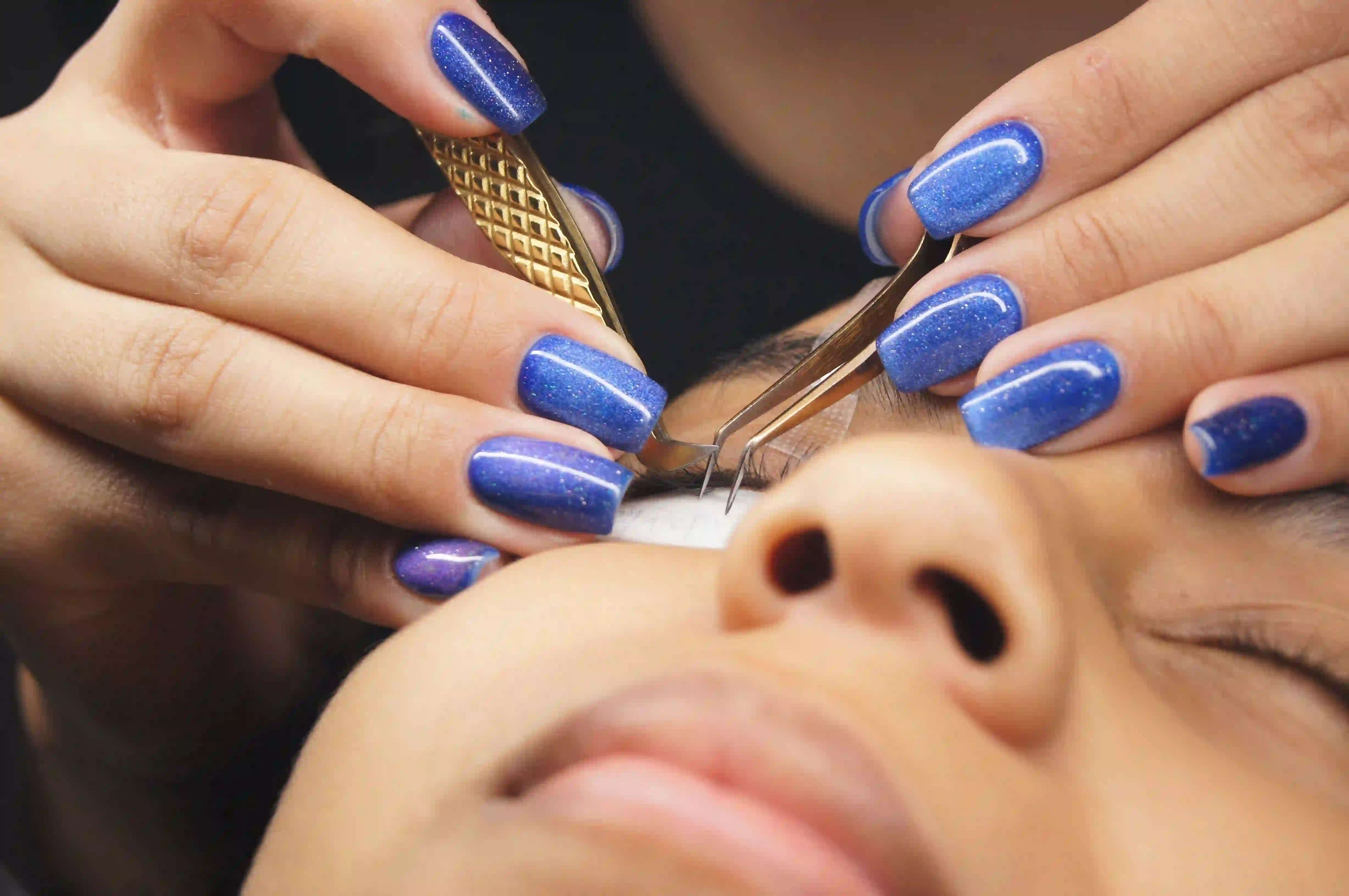 Professional eyelash tinting and dark lash color service at Meena Threading & Waxing Center