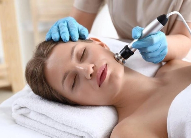 Microcurrent facial tightening procedure at Meena Threading & Waxing Center in NYC