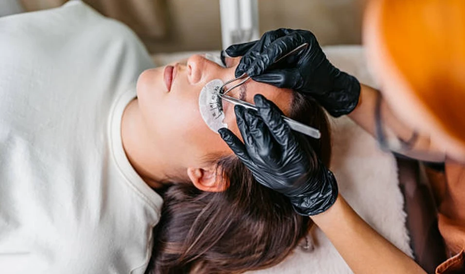 Professional eyelash extension procedure at Meena Threading & Waxing Center in NYC